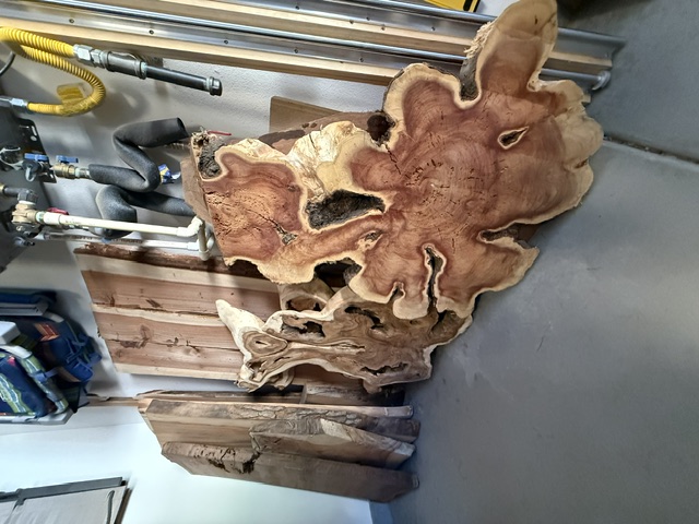 Large reddish exotic hardwood burl slab as raw material