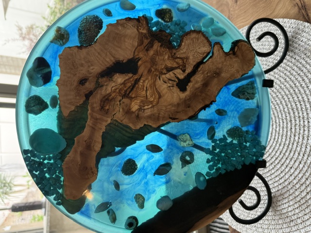 Circular exotic wood and blue resin statement table by Rick's Wood Crafts
